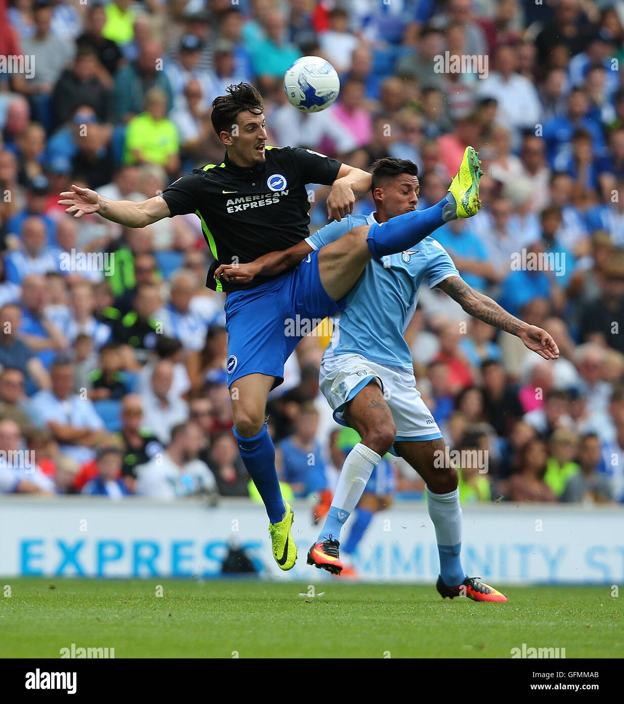 American Express Stadium, Brighton, Great Britain. 31st July 2016. Lewis Dunk ( L ) of Brighton and Hove Albion and Ricardo Kishna of Lazio challenge for the ball during a Pre-Season friendly match. Credit:  Tony Rogers/Alamy Live News Stock Photo