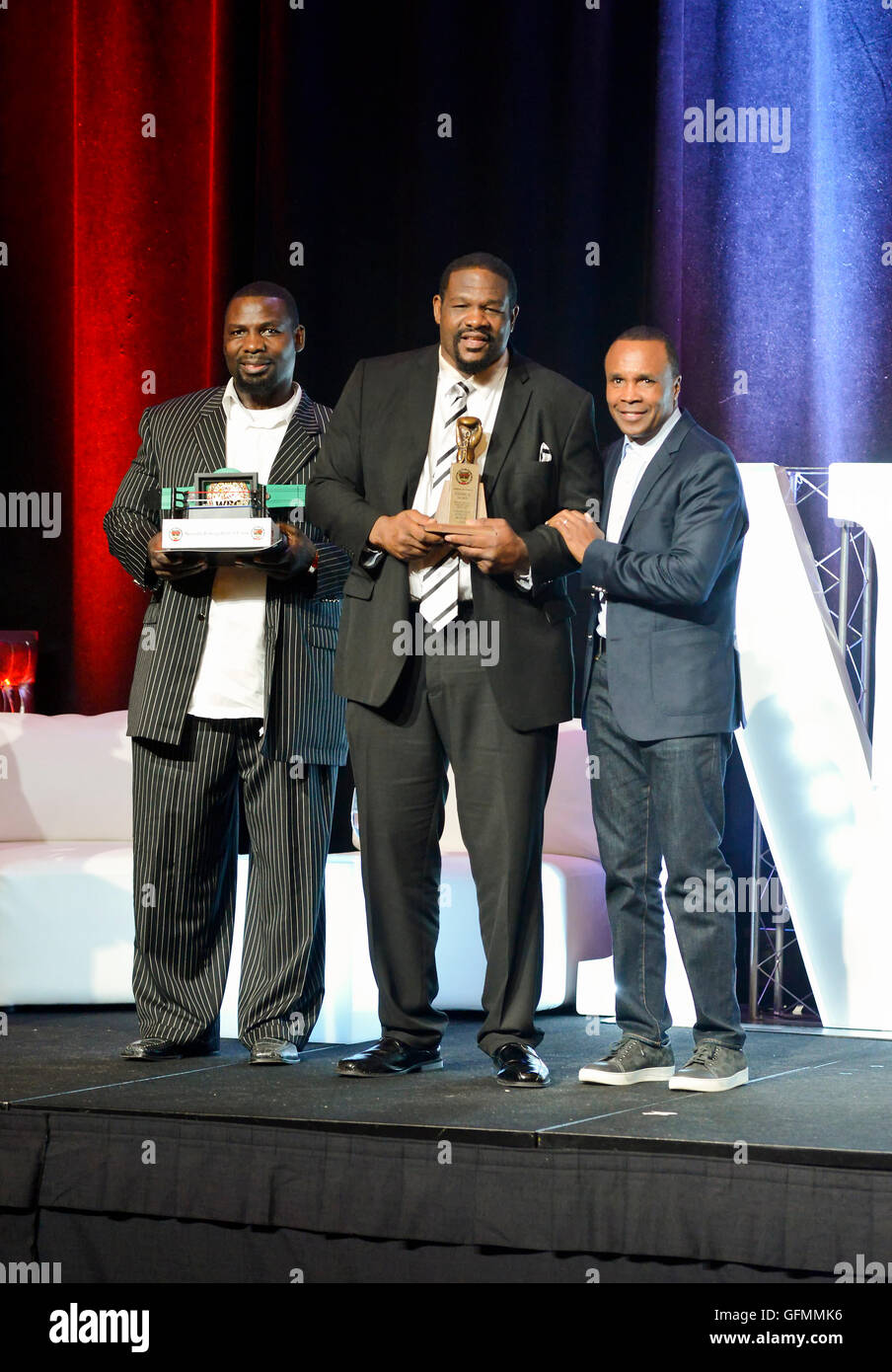 Las Vegas, Nevada, USA. 30th July, 2016. Riddick Bowe honored at the 4th Annual Nevada Boxing Hall of Fame Induction Ceremony. Standing with Sugar Ray Leonard and Hasim Rahman Credit:  Ken Howard/Alamy Live News Stock Photo