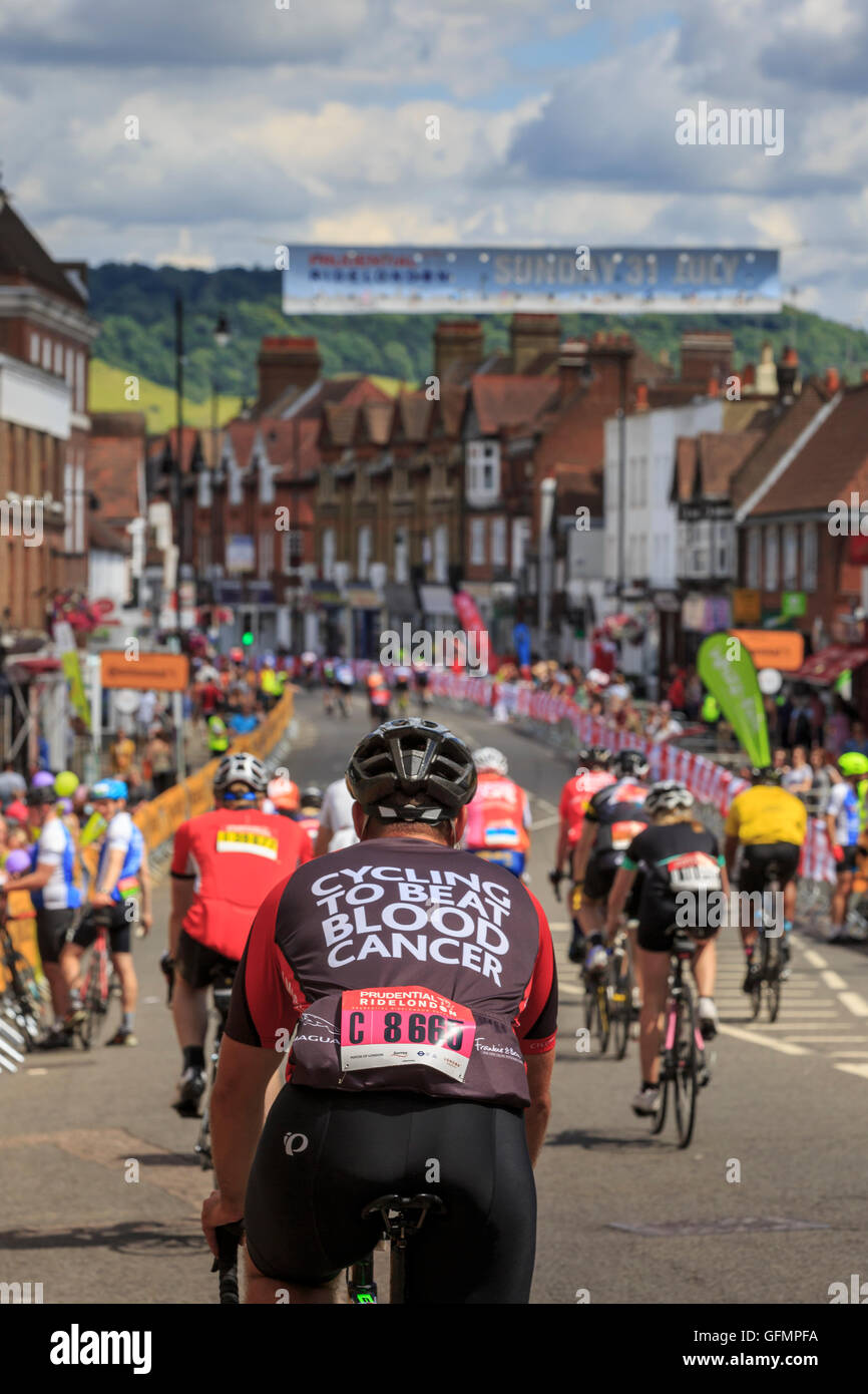 Dorking, Surrey, UK, 31 July 2016. Prudential RideLondon-Surrey 100. Riders pass through Dorking High Street whilst competng in the RideLondon-Surrey 100 - a 100 mile amateur sportive. Starting at the Queen Elizabeth Olympic Park and finishing on The Mall via Leith Hill and Box Hill in Surrey. Credit:  Clive Jones/Alamy Live News Stock Photo