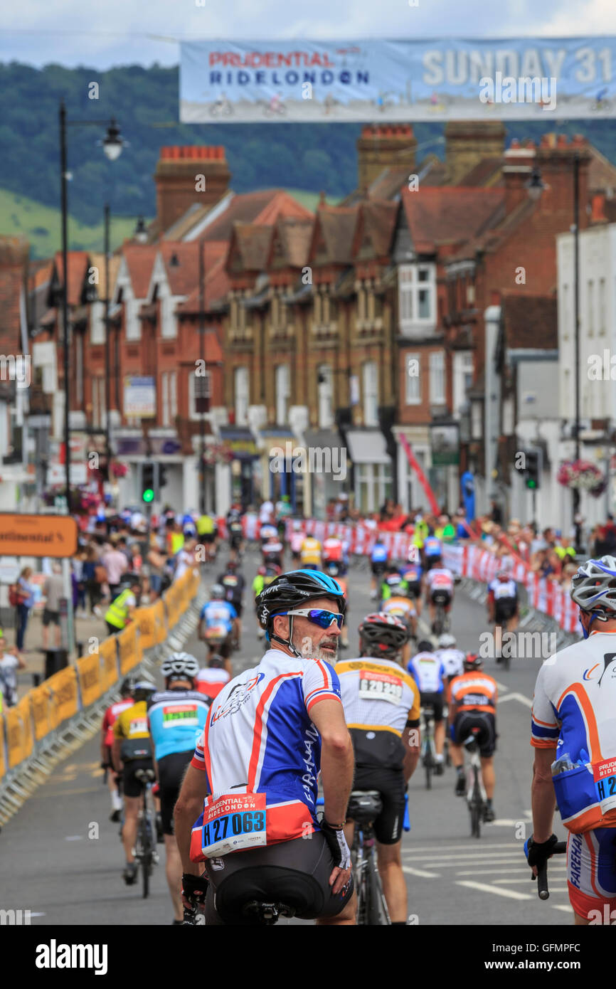 Dorking, Surrey, UK, 31 July 2016. Prudential RideLondon-Surrey 100. Riders pass through Dorking High Street whilst competng in the RideLondon-Surrey 100 - a 100 mile amateur sportive. Starting at the Queen Elizabeth Olympic Park and finishing on The Mall via Leith Hill and Box Hill in Surrey. Credit:  Clive Jones/Alamy Live News Stock Photo