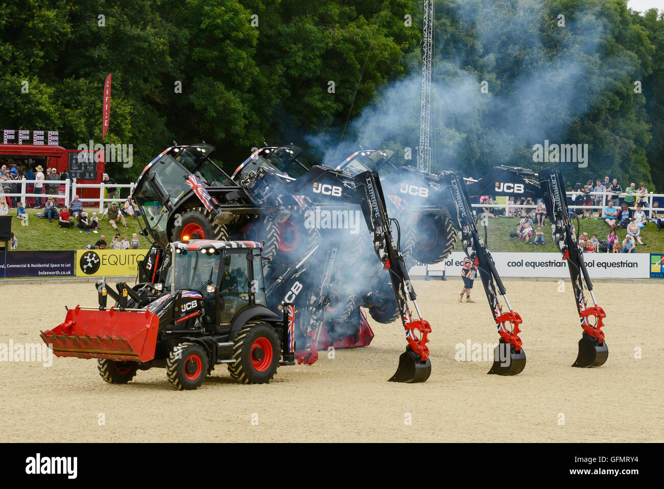 Carfest North, Bolesworth, Cheshire, UK. 31st July 2016. A choreographed display of JCB tigers in the Showground arena. The event is the brainchild of Chris Evans and features 3 days of cars, music and entertainment with profits being donated to the charity Children in Need. Andrew Paterson/Alamy Live News Stock Photo