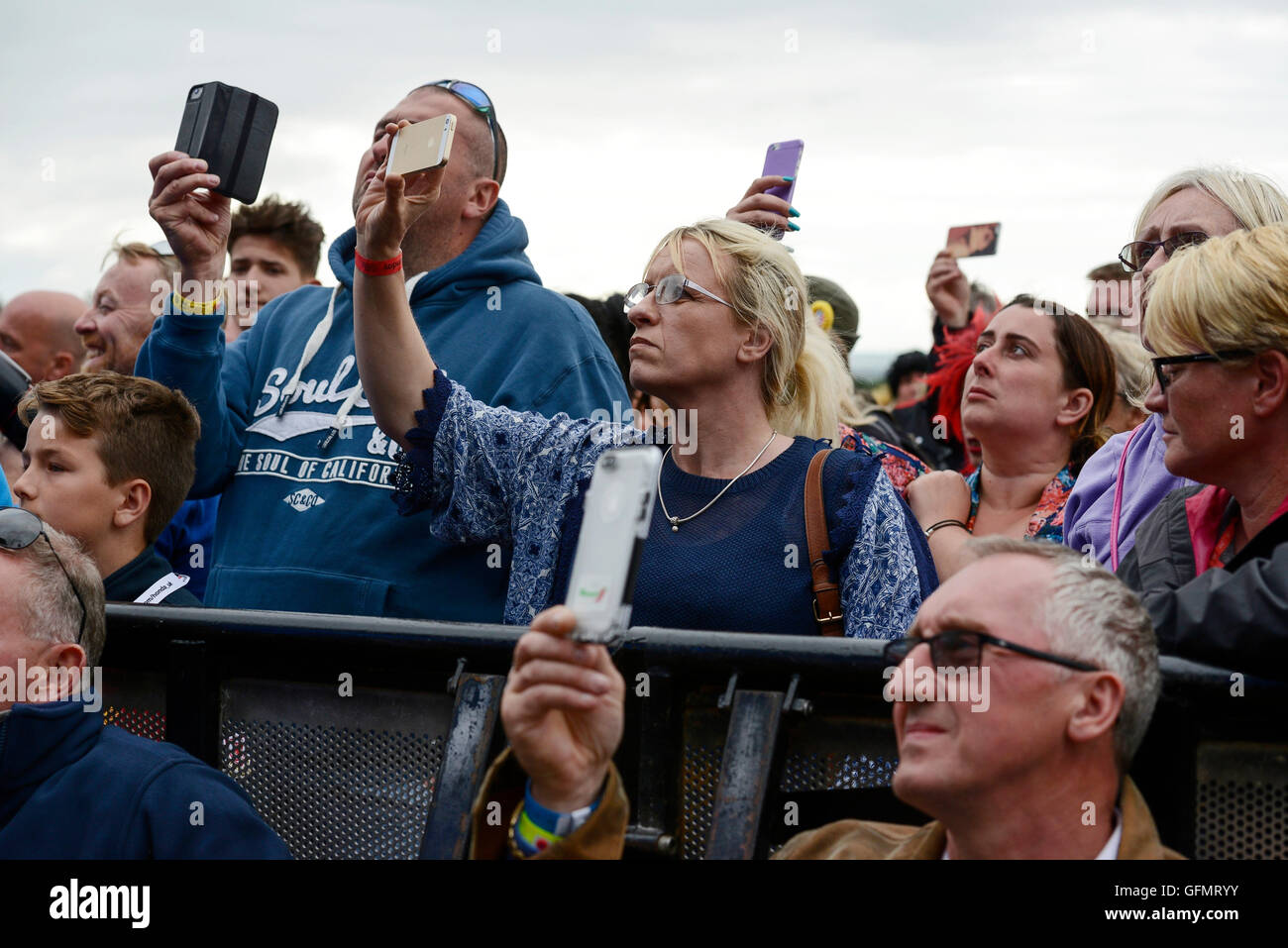 Carfest North, Bolesworth, Cheshire, UK. 31st July 2016. People filming a performance on the Main stage. The event is the brainchild of Chris Evans and features 3 days of cars, music and entertainment with profits being donated to the charity Children in Need. Andrew Paterson/Alamy Live News Stock Photo