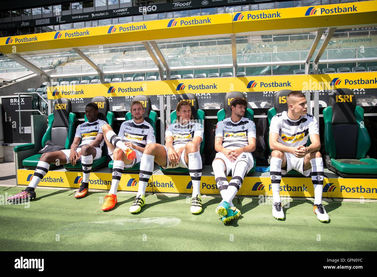 Borussia Moenchengladbach players Mamadou Doucoure, Christoph Kramer,  Jannik Vestergaard, Tobias Strobl and Laszlo Benes sit on the bank for a  photo shoot for the 2016/17 season in the Borussia Park in Moenchengladbach,