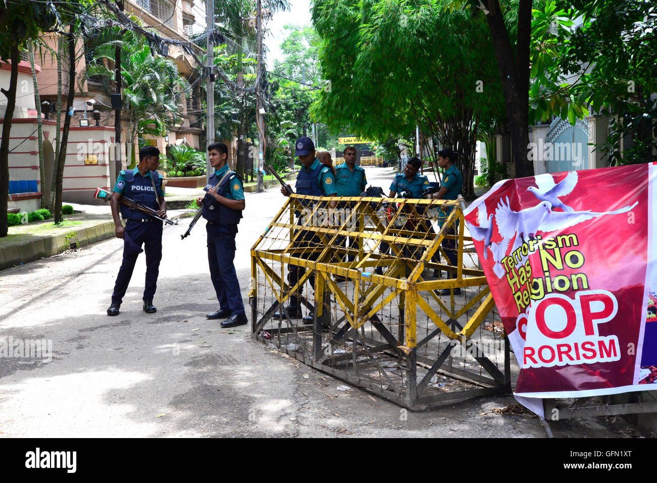 Dhaka, Bangladesh. 01st Aug, 2016. Bangladeshi policemen stand guard in front of Holey Artisan Bakery restaurant in Dhaka on August 1, 2016, in a street leading to the entrance of a Holey Artisan Bakery restaurant which was the site of a bloody siege that ended in the death of seventeen foreigners and five Bangladeshis on July 1. Credit:  Mamunur Rashid/Alamy Live News Stock Photo