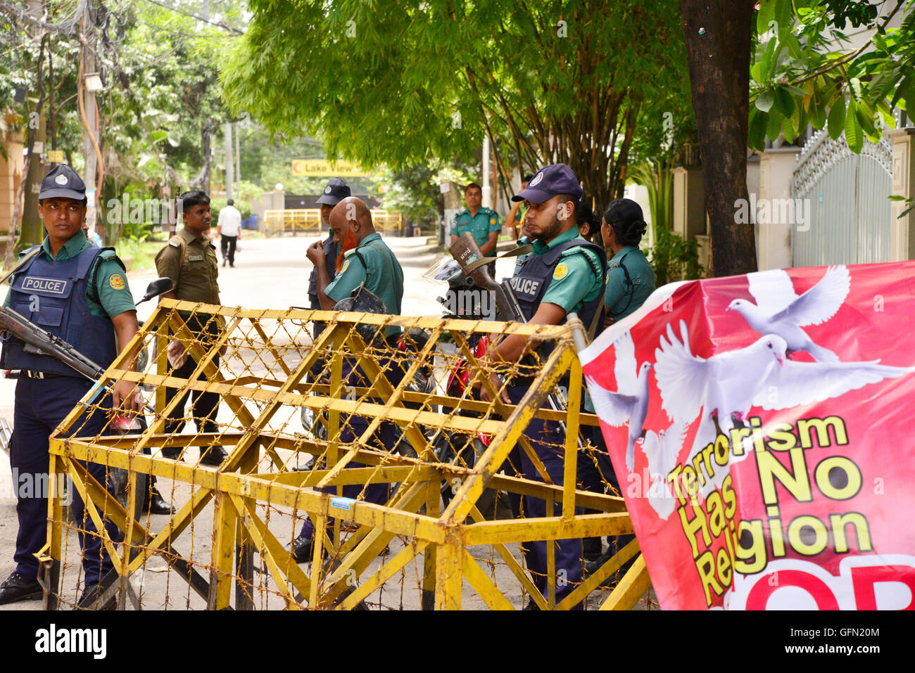 Dhaka, Bangladesh. 01st Aug, 2016. Bangladeshi policemen stand guard in front of Holey Artisan Bakery restaurant in Dhaka on August 1, 2016, in a street leading to the entrance of a Holey Artisan Bakery restaurant which was the site of a bloody siege that ended in the death of seventeen foreigners and five Bangladeshis on July 1. Credit:  Mamunur Rashid/Alamy Live News Stock Photo