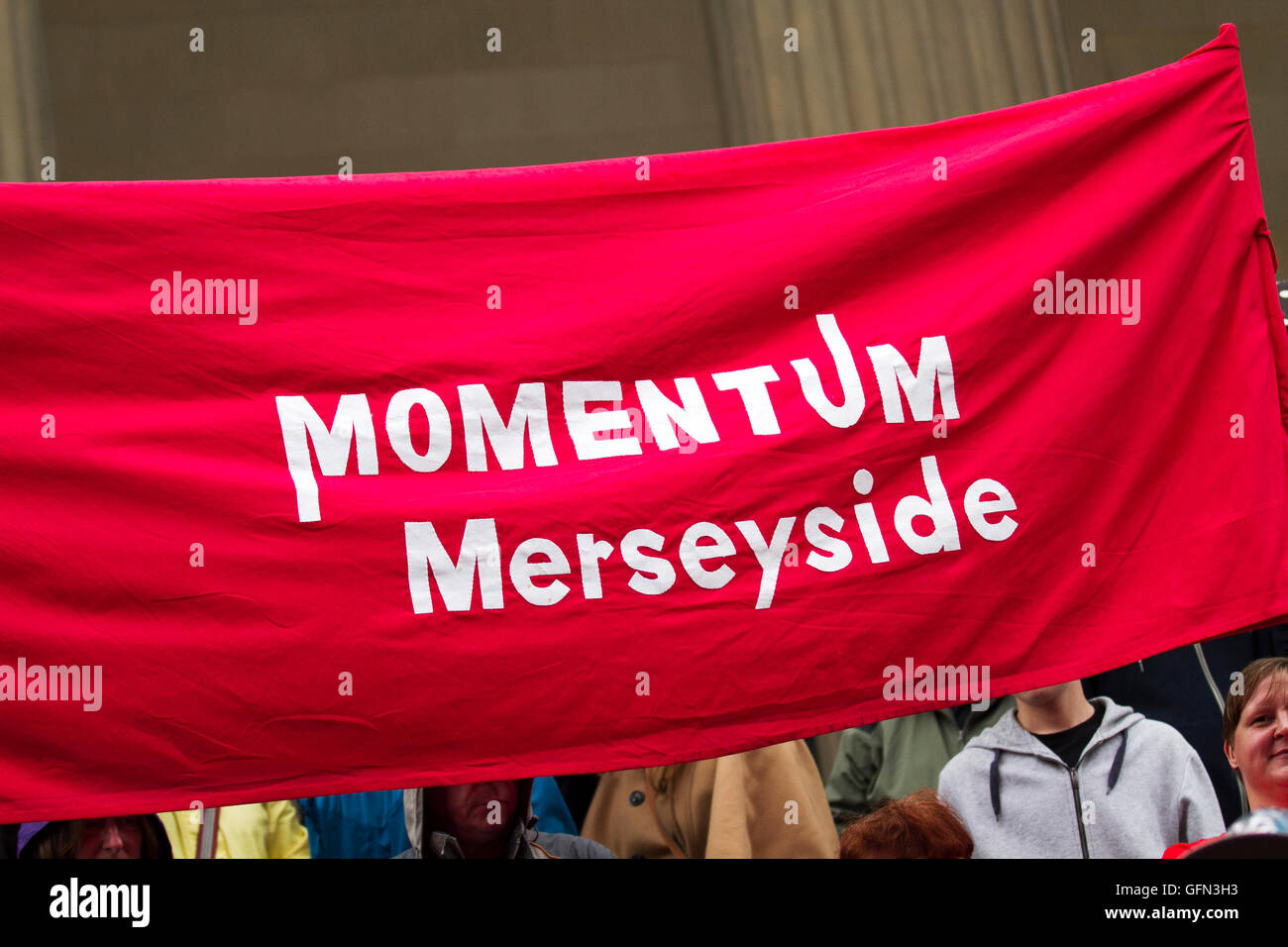 Liverpool, Merseyside, UK. 1st August 2016. Jeremy Corbyn addresses rally.  A tired looking Jeremy Corbyn attends a party rally in the Labour heartland of Liverpool, Merseyside.  Only a thousand or so Corbyn supporters sprouting torn cardboard slogans showed up on the steps outside St' Georges Hall.   If these hardcore voters were expecting a statesman to appear, they were sadly disappointed. Credit:  Cernan Elias/Alamy Live News Stock Photo