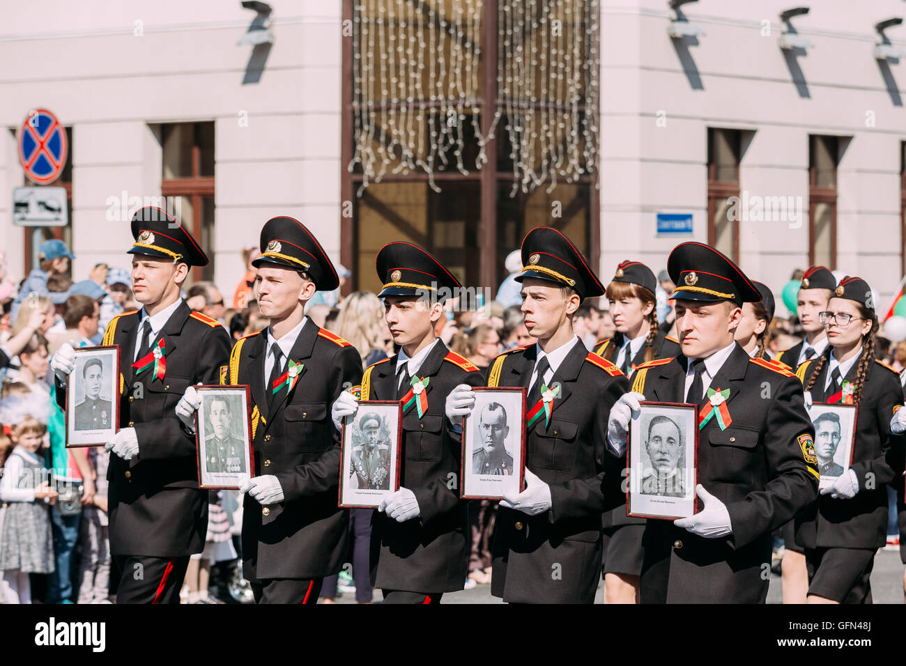 The Marching Formation Of Cadet Guys From Gomel State Cadet School With Portraits Of WW2 Heroes Foreground Of Ceremonial Parade Stock Photo