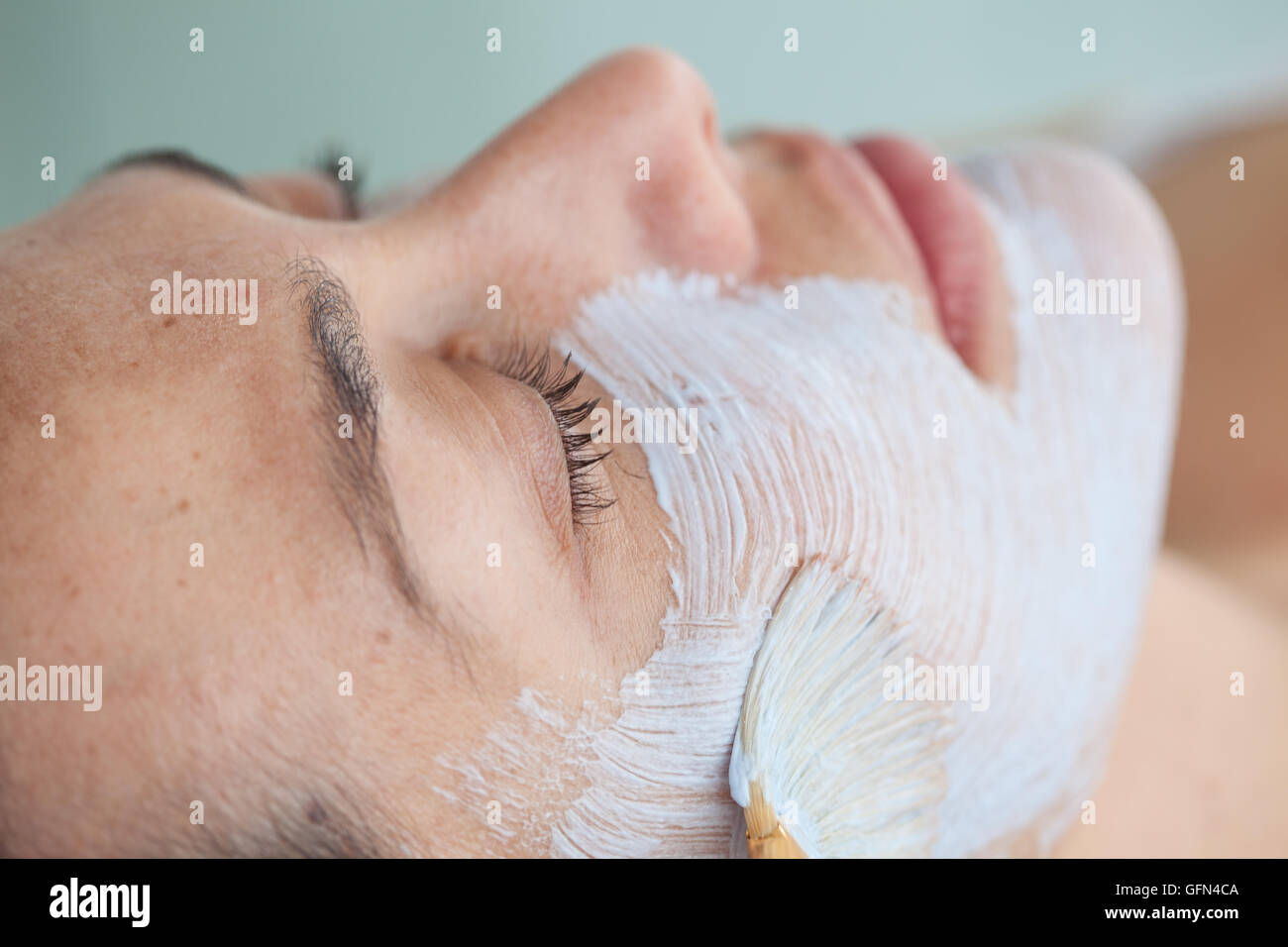 Facial mask application on young female patient Stock Photo Alamy