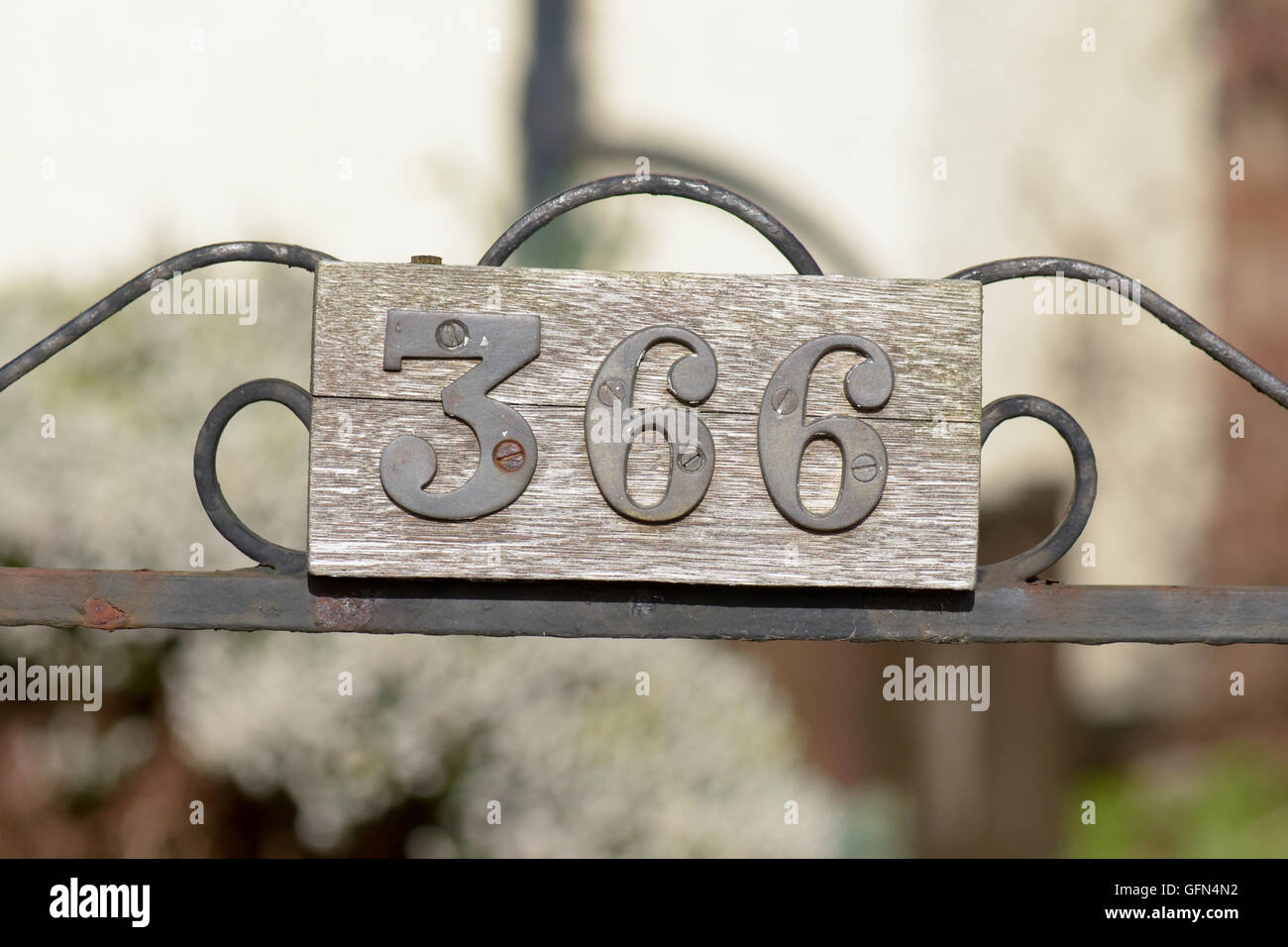 House number 366 sign on gate Stock Photo - Alamy