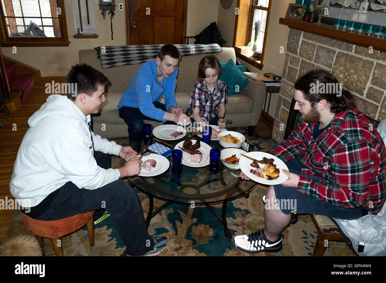 Kids eating at children's table during family Easter dinner and festivities. St Paul Minnesota MN USA Stock Photo