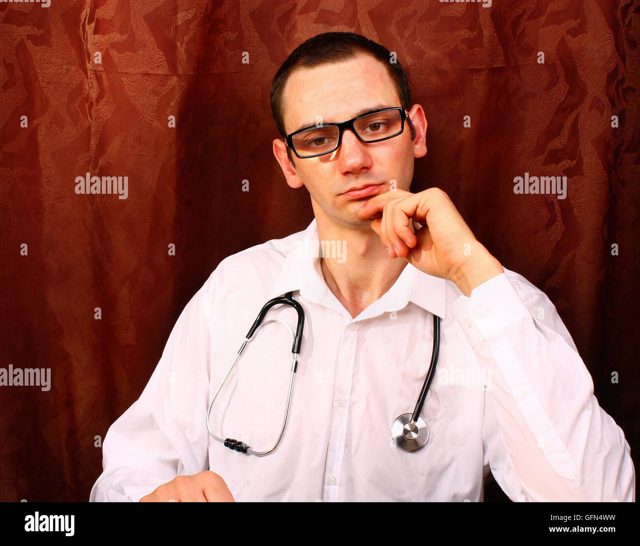 Young unshaven male doctor hi-res stock photography and images - Alamy
