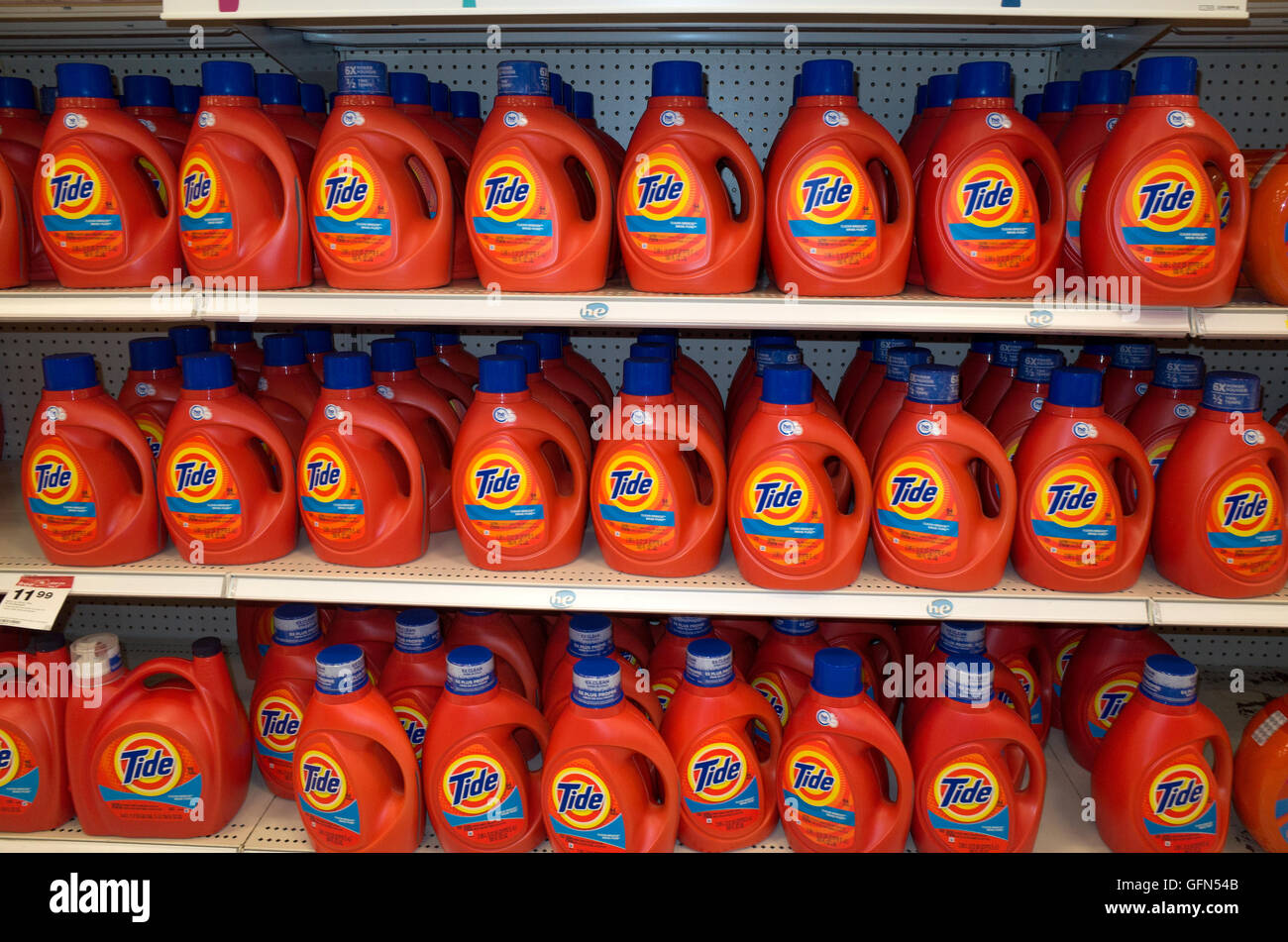 Three rows of Tide laundry detergent on shelves of a retail store. St