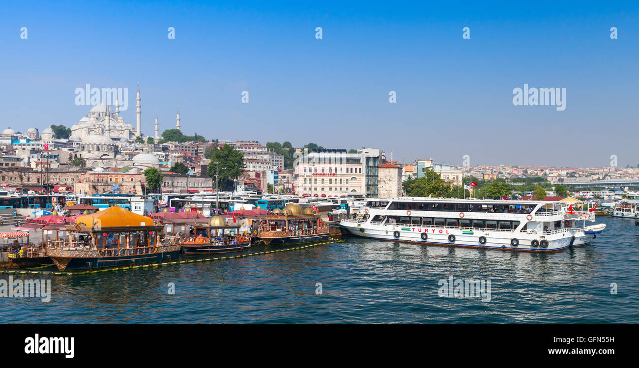 Istanbul, Turkey - July 1, 2016: Cityscape with passenger ship in Golden Horn a major urban waterway and the primary inlet Stock Photo