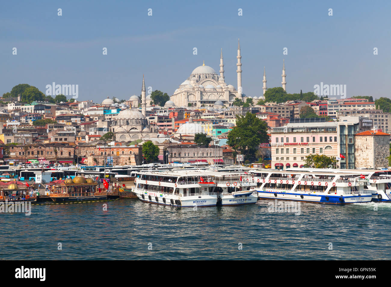 Istanbul, Turkey - July 1, 2016: Cityscape with passenger ships in Golden Horn a major urban waterway and the primary inlet of t Stock Photo