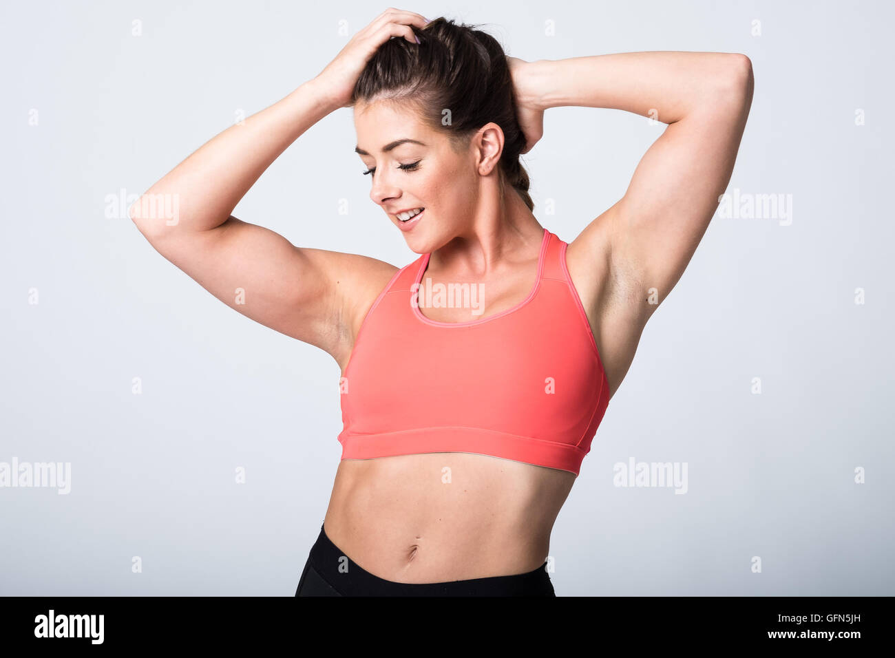 Woman showing off biceps abs hi-res stock photography and images - Alamy