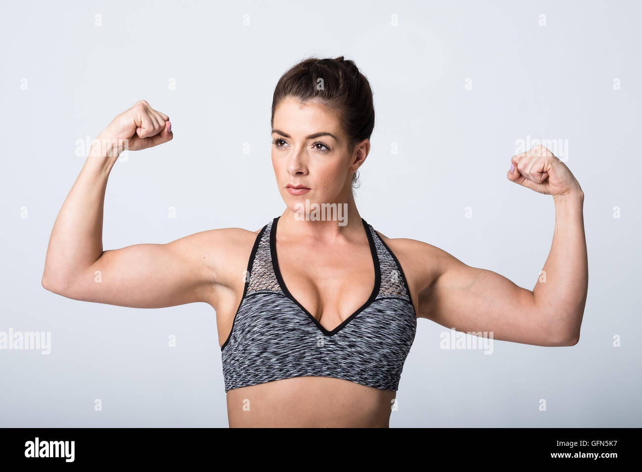 Female bodybuilder flexing muscles in hi-res stock photography and images -  Alamy