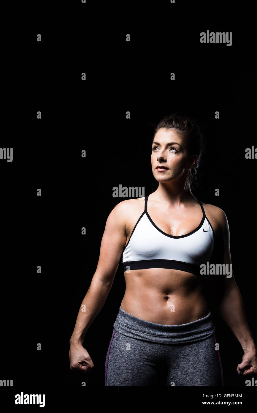 Confident, fit, toned woman in training gear Stock Photo