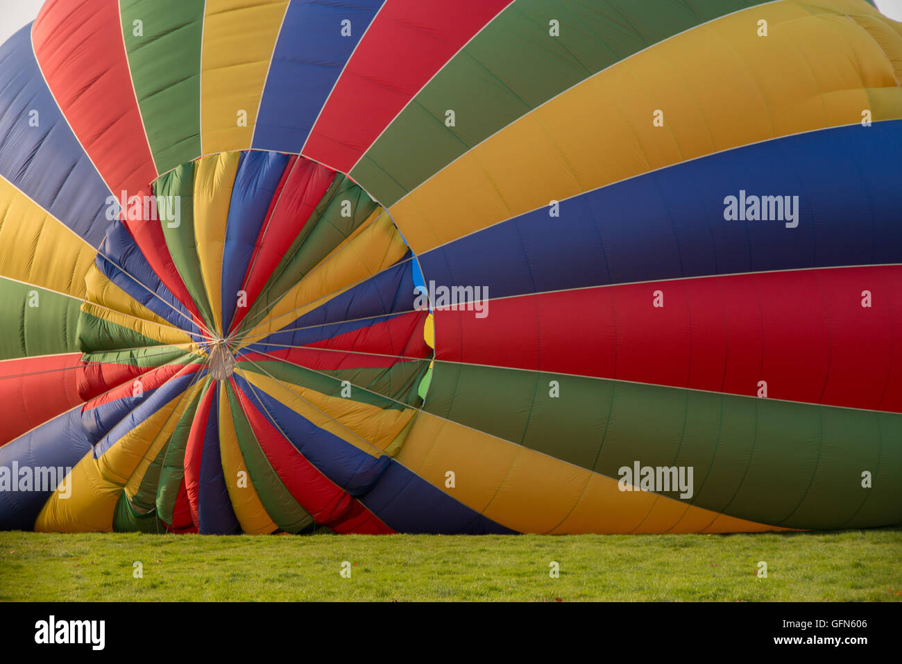 Colorful hot air balloon being inflated Stock Photo - Alamy