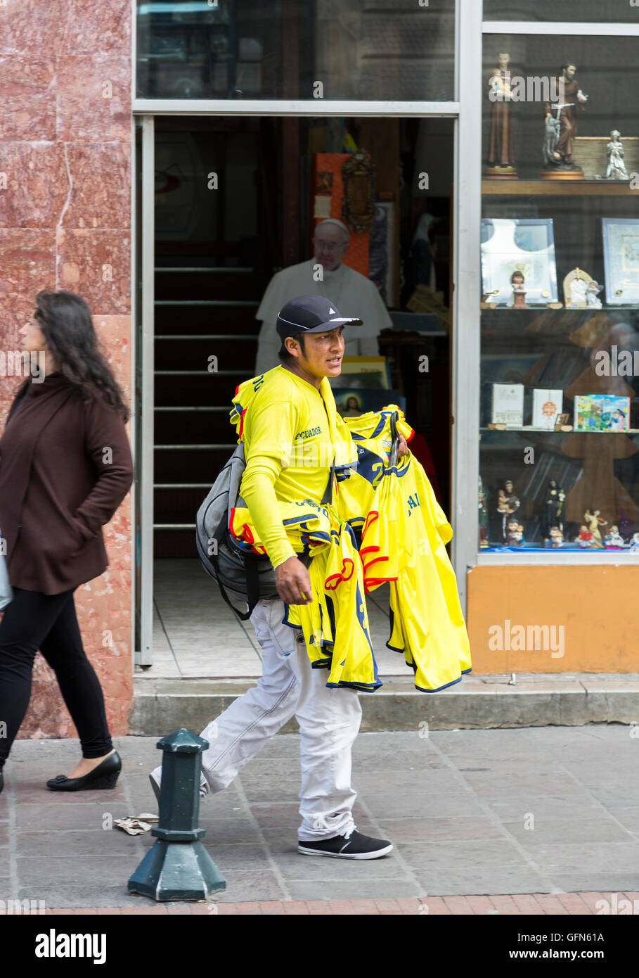 Local street trader selling yellow replica Ecuador national team football shirts, Quito, capital of Ecuador, South America Stock Photo