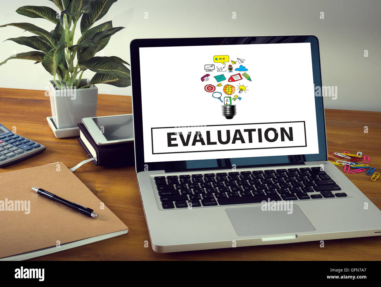 EVALUATION Laptop on table. Warm tone Stock Photo