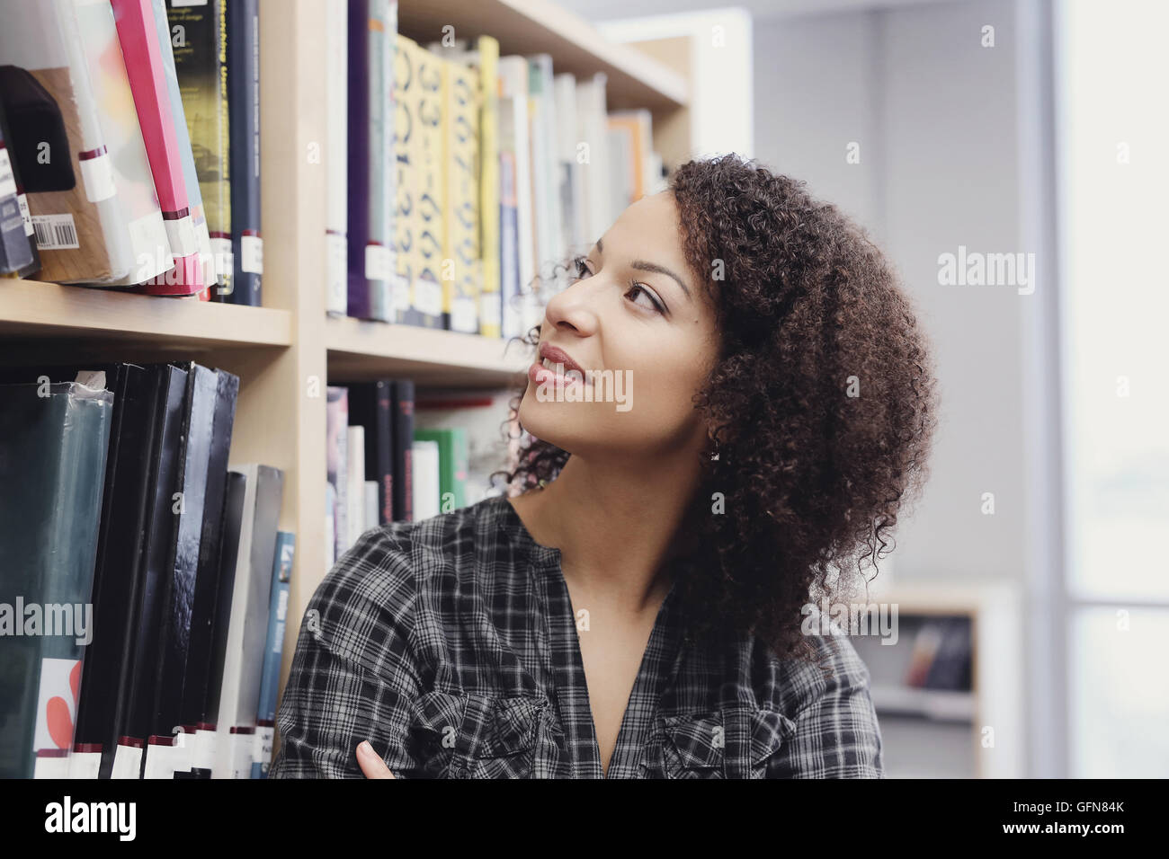 Student in library Stock Photo - Alamy