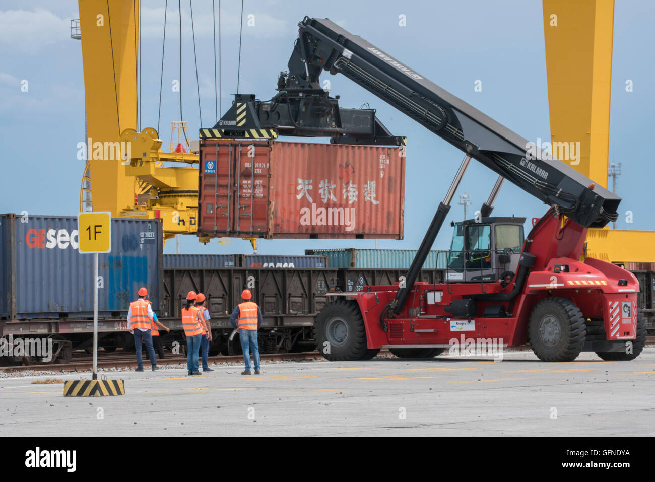 Trains with different gauges from China and Kazakhstan have loads transferred at a dry port in Khorgos, Kazakhstan. Stock Photo