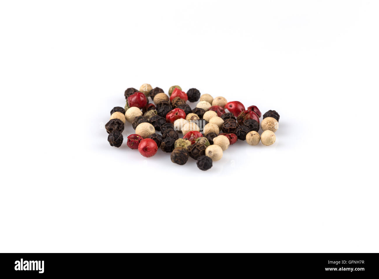 heap of various pepper peppercorns seeds mix on white Stock Photo Alamy
