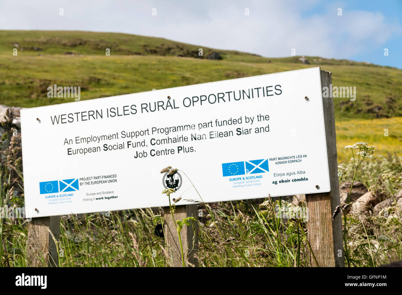 European flag logo or EU insignia on sign for partially EU funded Western Isles Rural Opportunities on Barra in the Outer Hebrides, Scotland. Stock Photo
