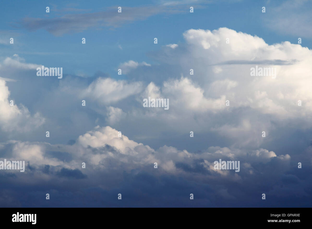 Fluffy clouds in a blue sky Stock Photo