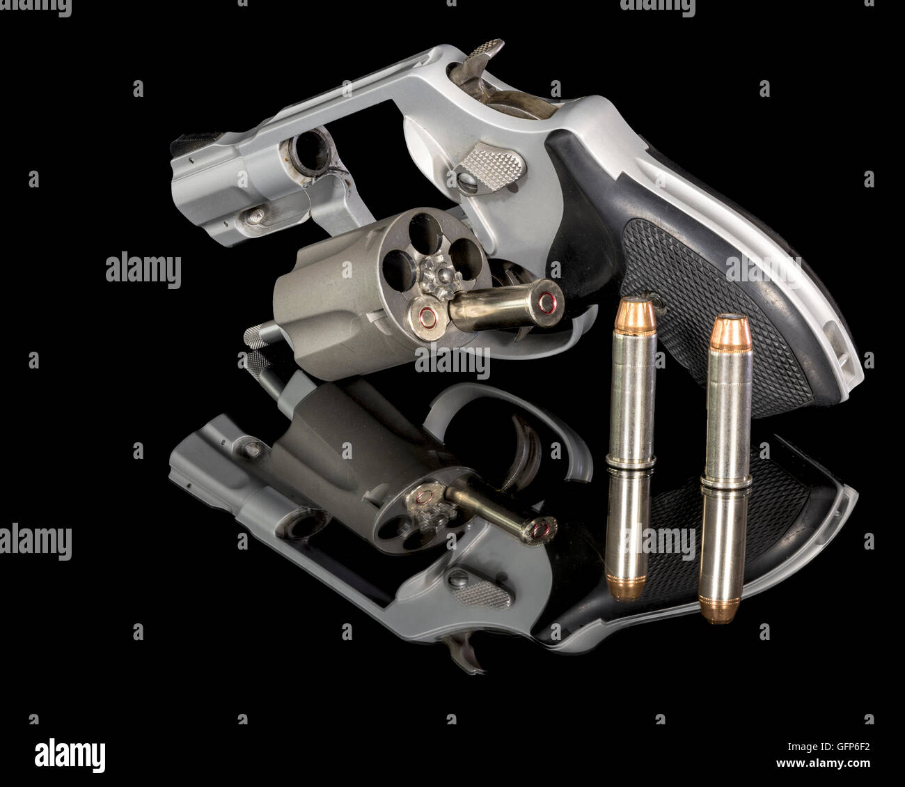 Small pistol with bullets and reflection Stock Photo