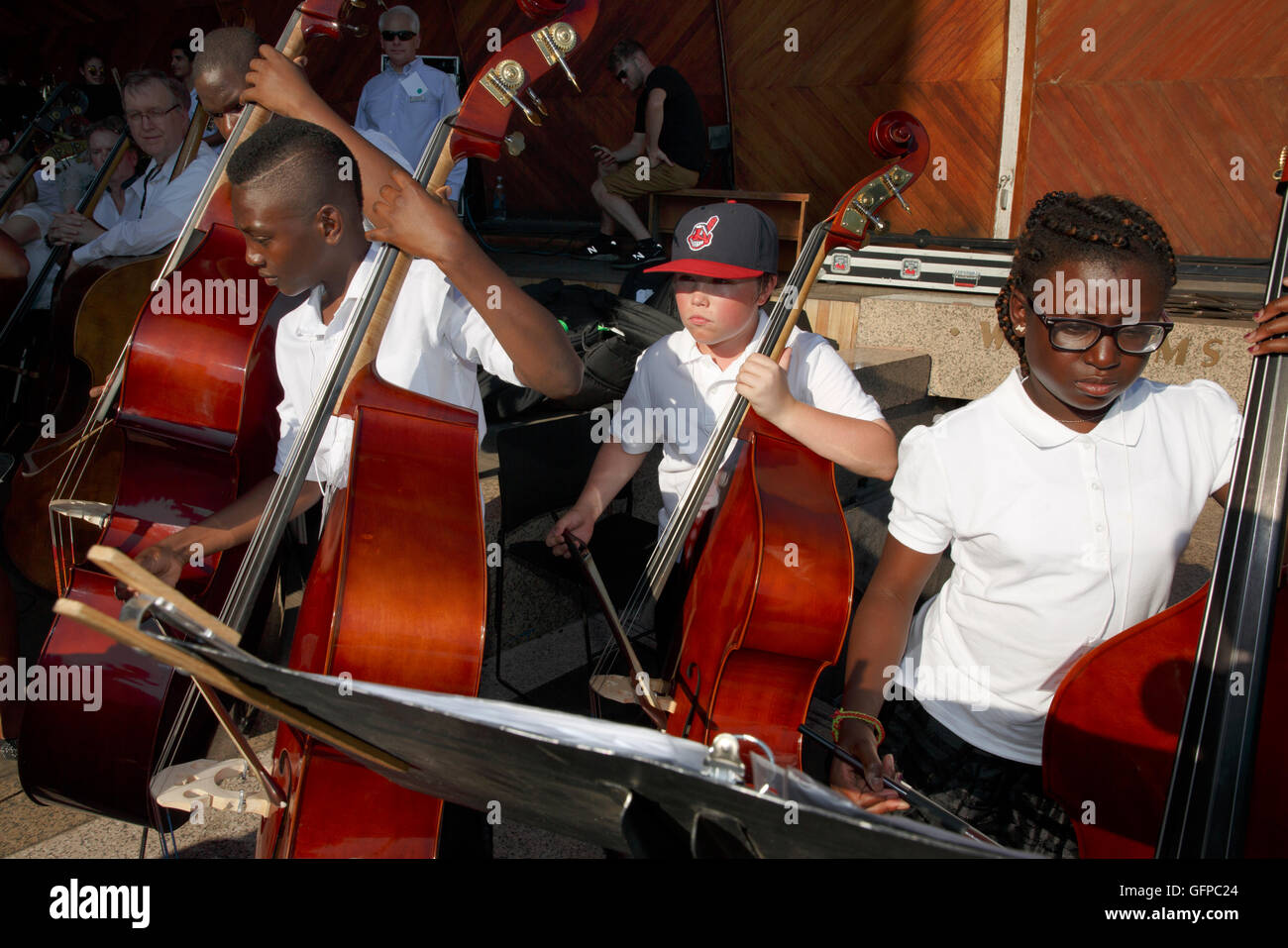 Young musicians playing with the Boston Landmarks Orchestra at the Hatch Shell, Boston, Massachusetts Stock Photo