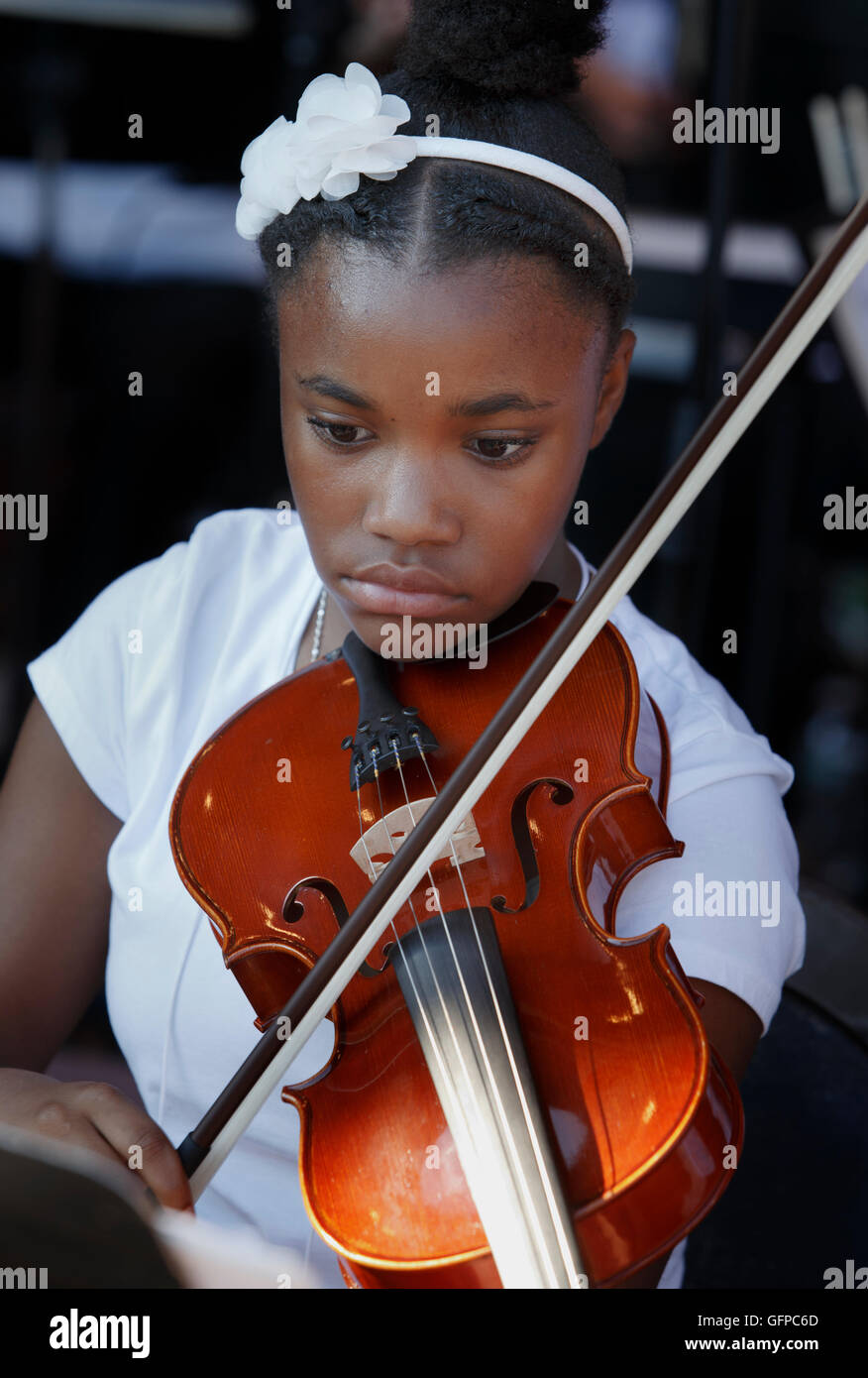 Young musician playing with the Boston Landmarks Orchestra at the Hatch Shell, Boston, Massachusetts Stock Photo