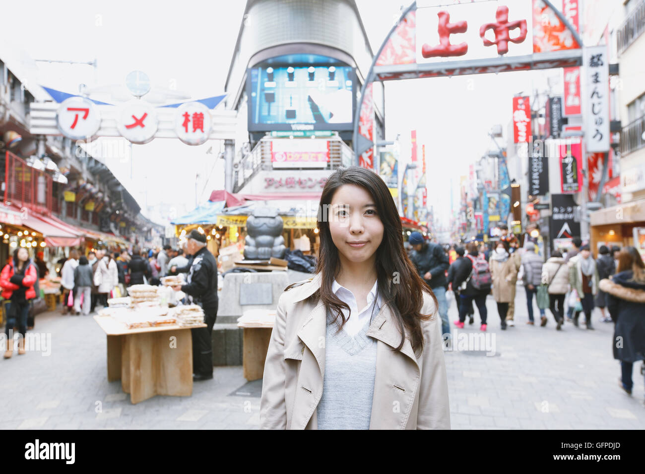 Young attractive Japanese woman downtown Tokyo Stock Photo