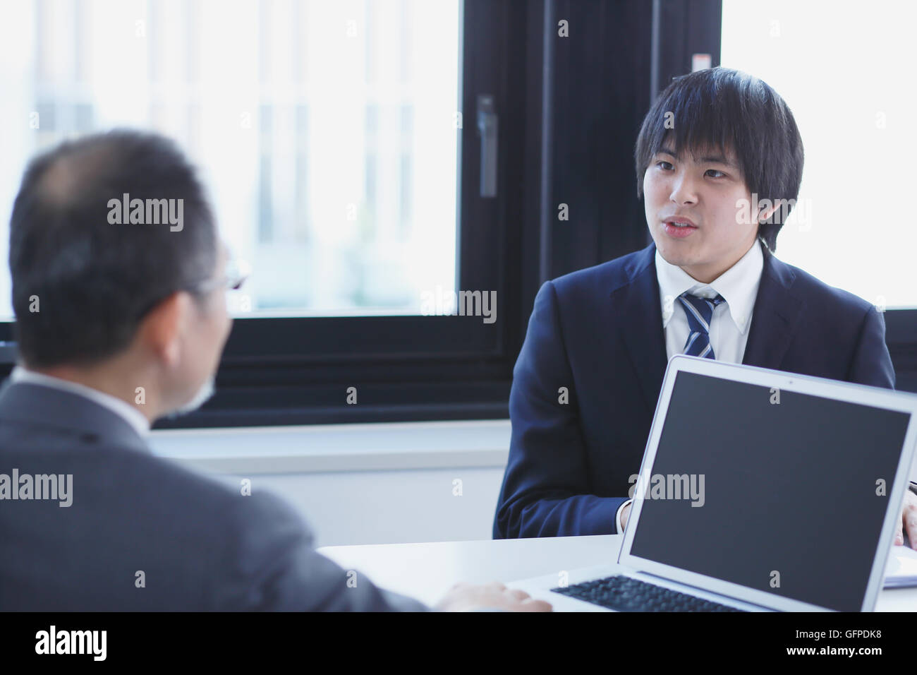 Japanese businesspeople in a modern office Stock Photo