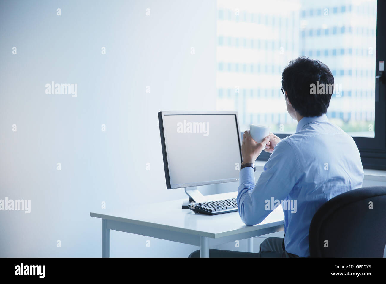 Japanese businessman in a modern office Stock Photo