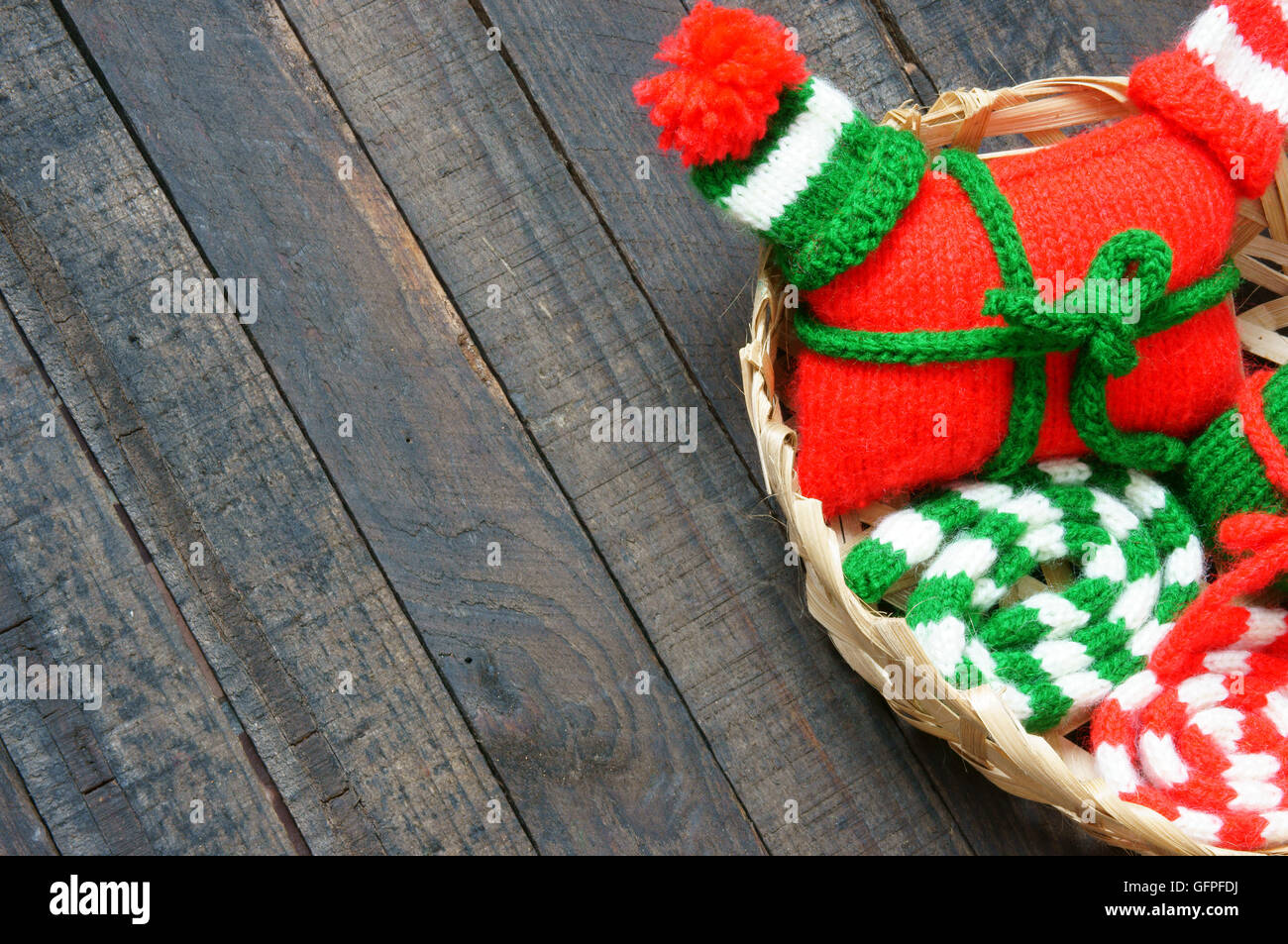 Christmas ornament for winter holiday, red and green knitted hat, scaft, sock, gift  in small size, symbol for xmas, noel season Stock Photo