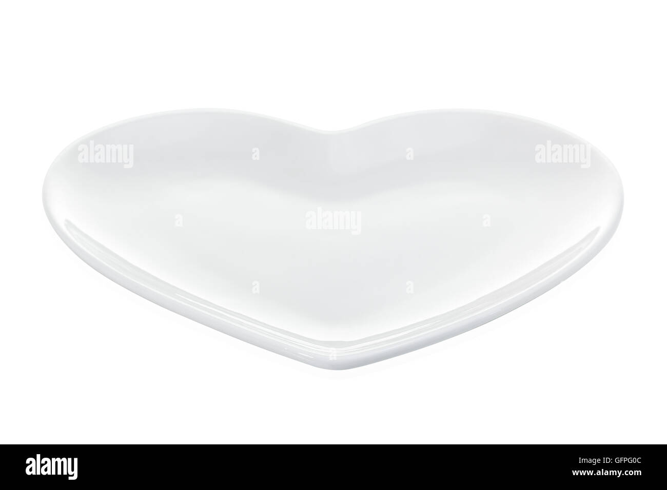 Heart form white plate isolated on white with clipping path Stock Photo ...