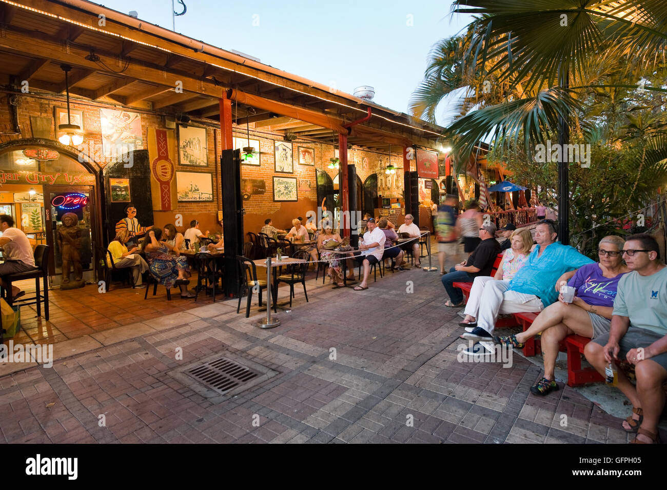 Tourists are eating and relaxing at a restaurant near Mallory Square in Key West in Florida Stock Photo