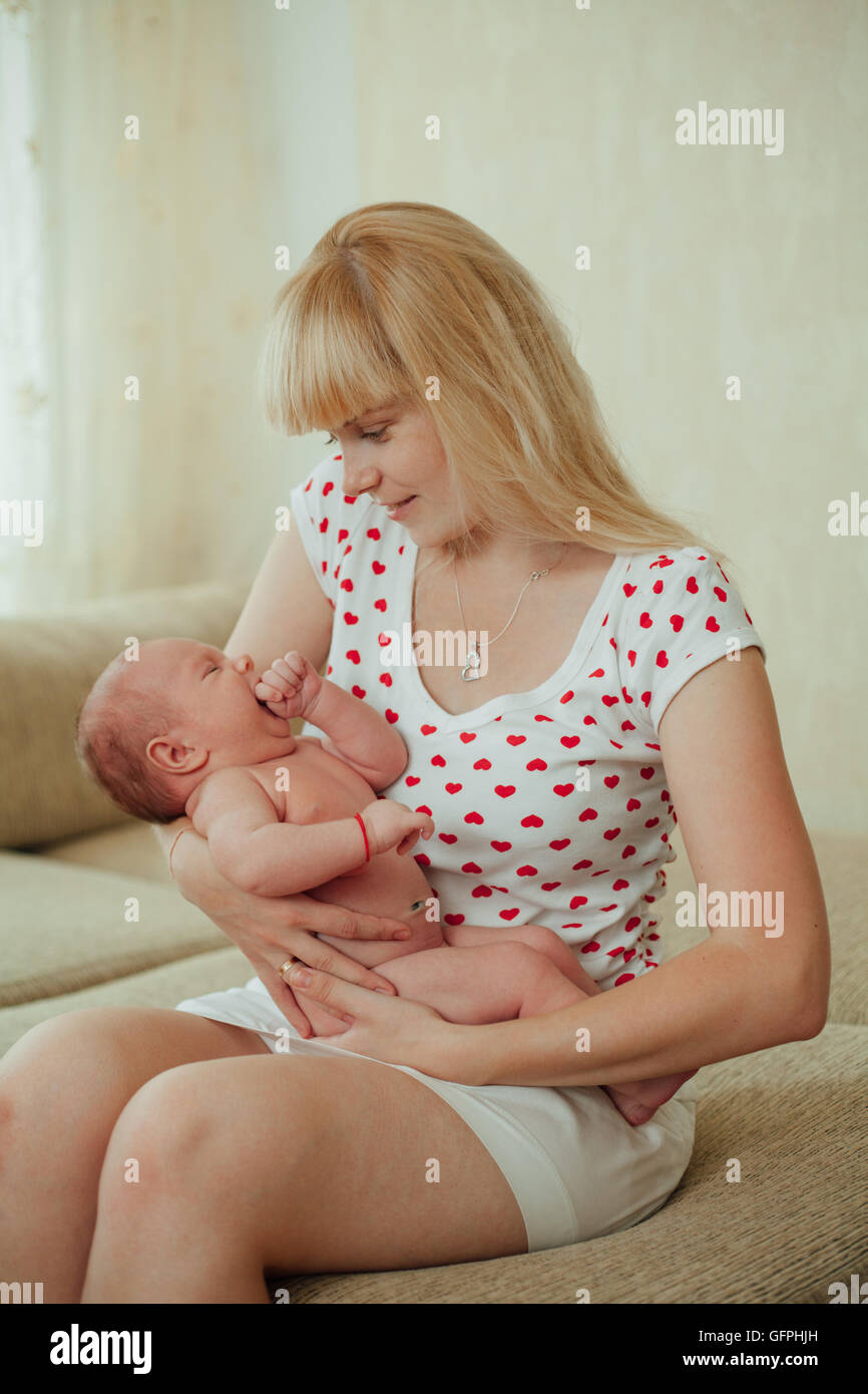 Young mother hugging baby Stock Photo