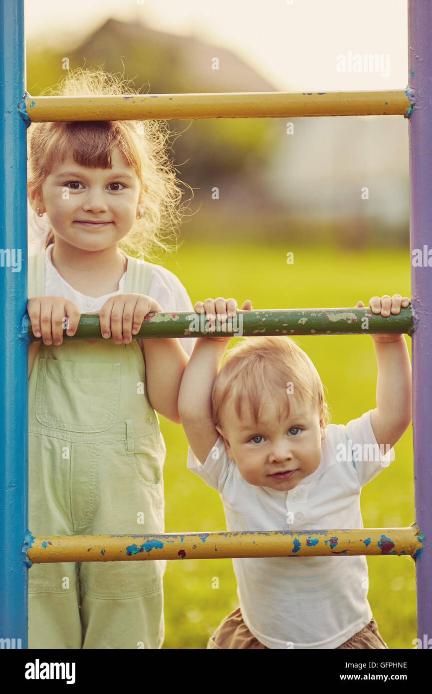 boy and girl playing on playground Stock Photo - Alamy
