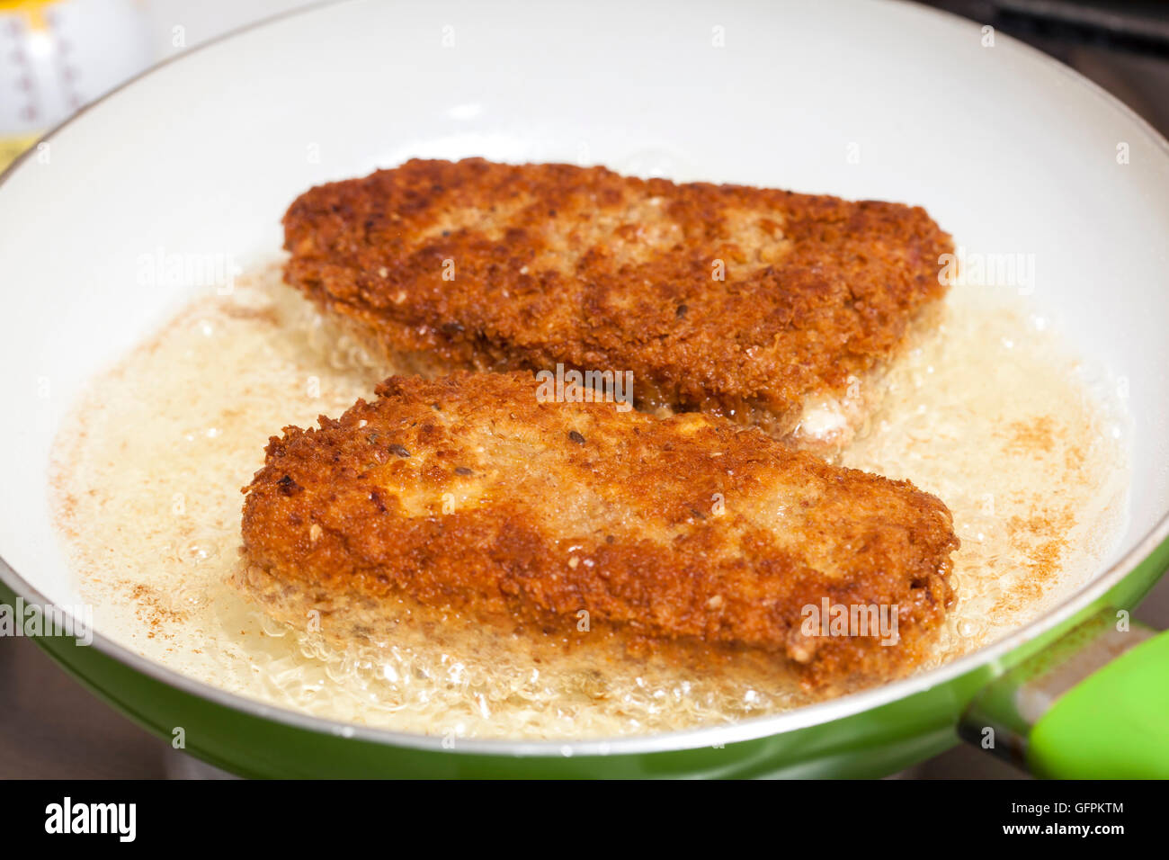 Frying a cordon bleu Stock Photo Alamy