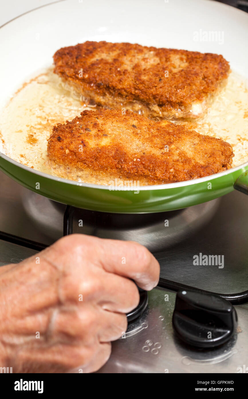 Frying a cordon bleu Stock Photo Alamy