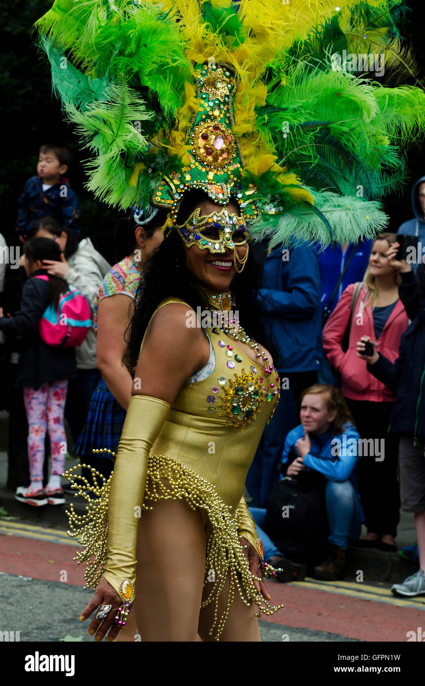 Female dancer in sequinned mask and  taking part in the Carnival Parade, part of the Edinburgh Jazz Festival. Stock Photo