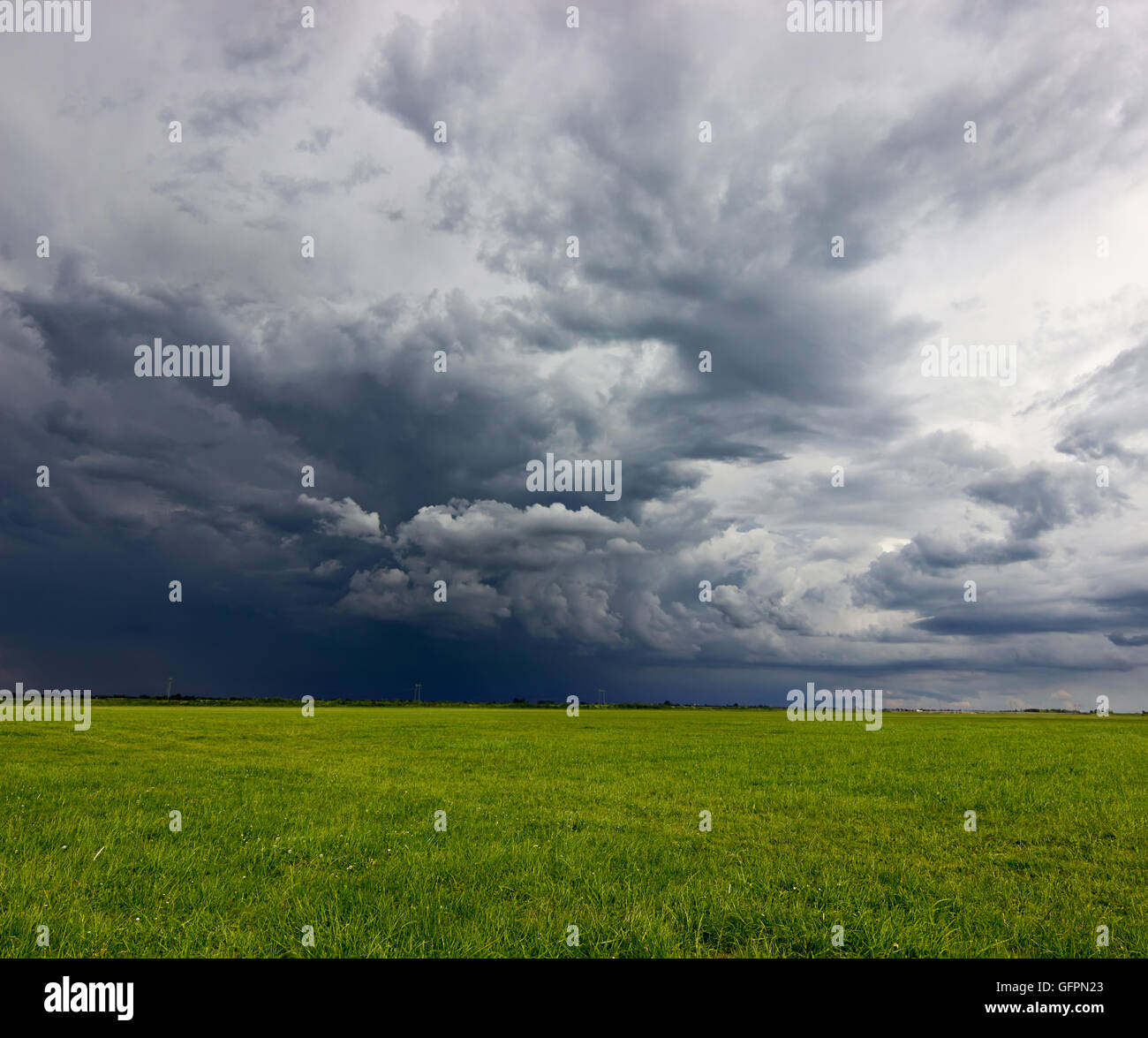 Supercell storm clouds above meadow with green grass Summer Storm ...