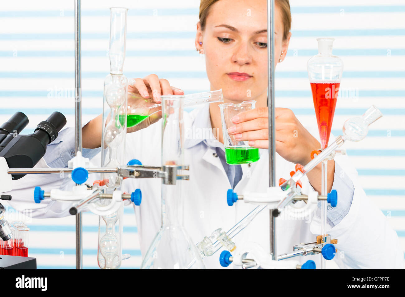 Chemical laboratory scene attractive young student and her post
