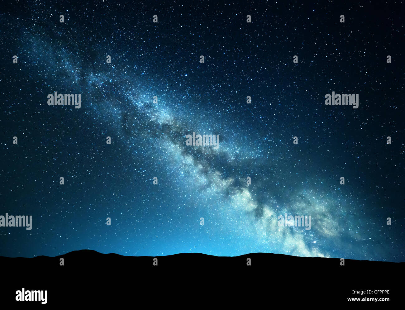 Night landscape with amazing Milky Way at mountains. Blue night starry sky with hills at summer. Beautiful Galaxy. Universe. Spa Stock Photo