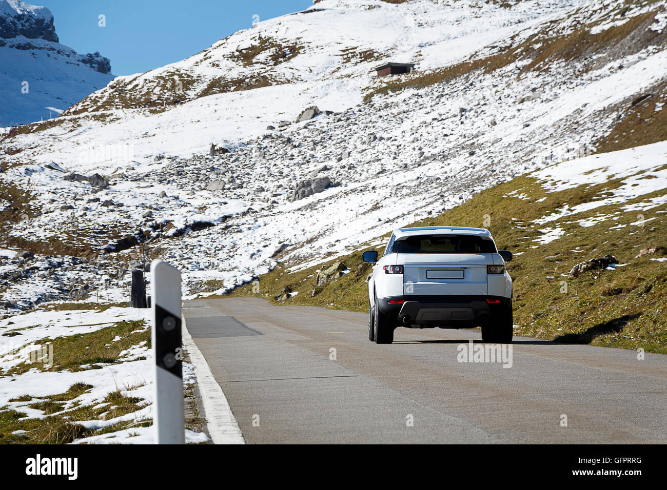 A car driving on a mountain road, could be used to show a driving adventure / holiday Stock Photo