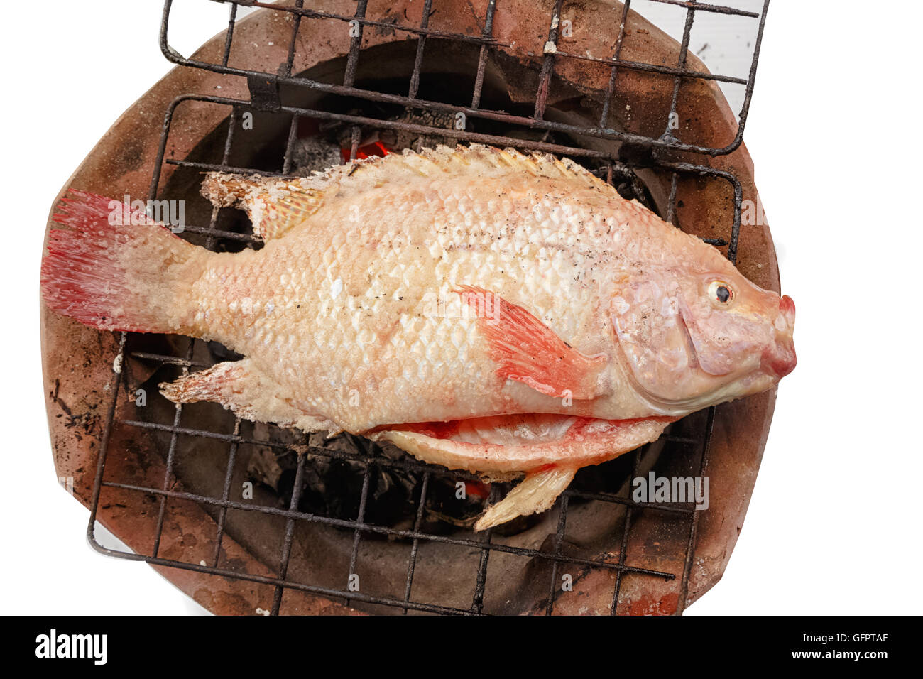 Grilled red nile tilapia fish on charcoal stove Stock Photo Alamy