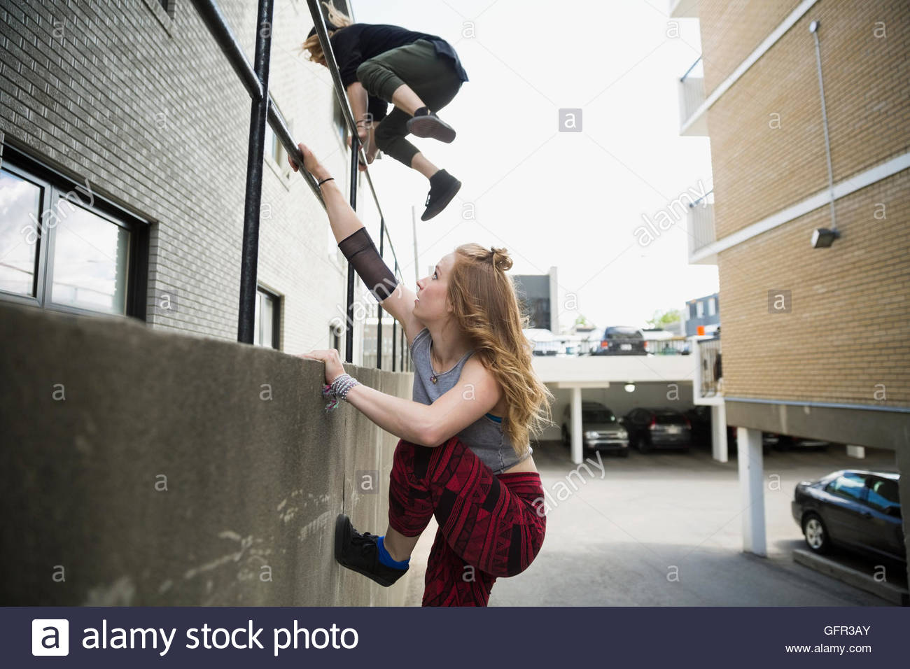 Young man jumping over railing hires stock photography and images Alamy
