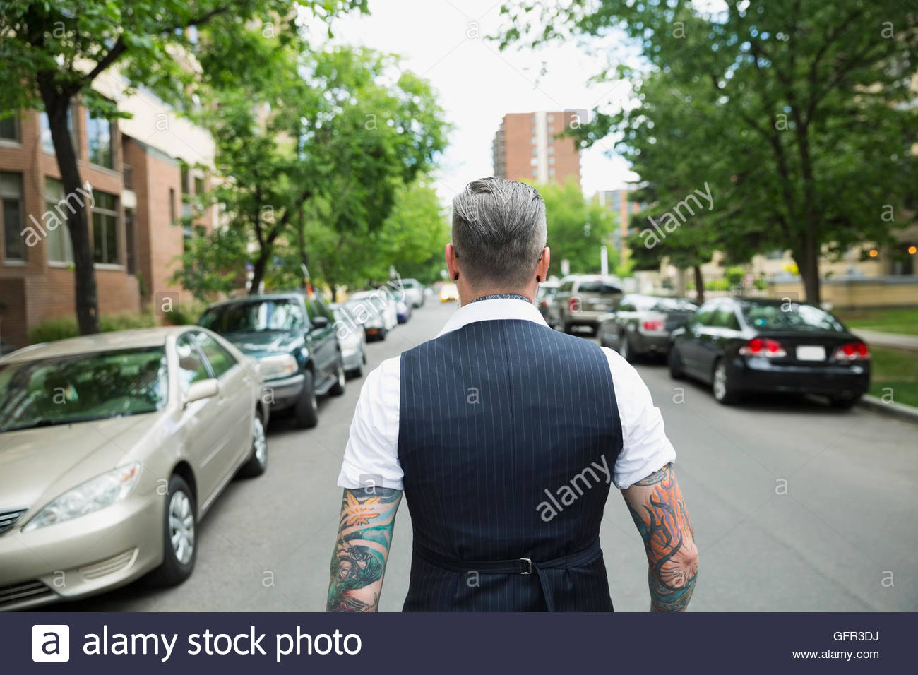 One man walking down street hi-res stock photography and images - Alamy